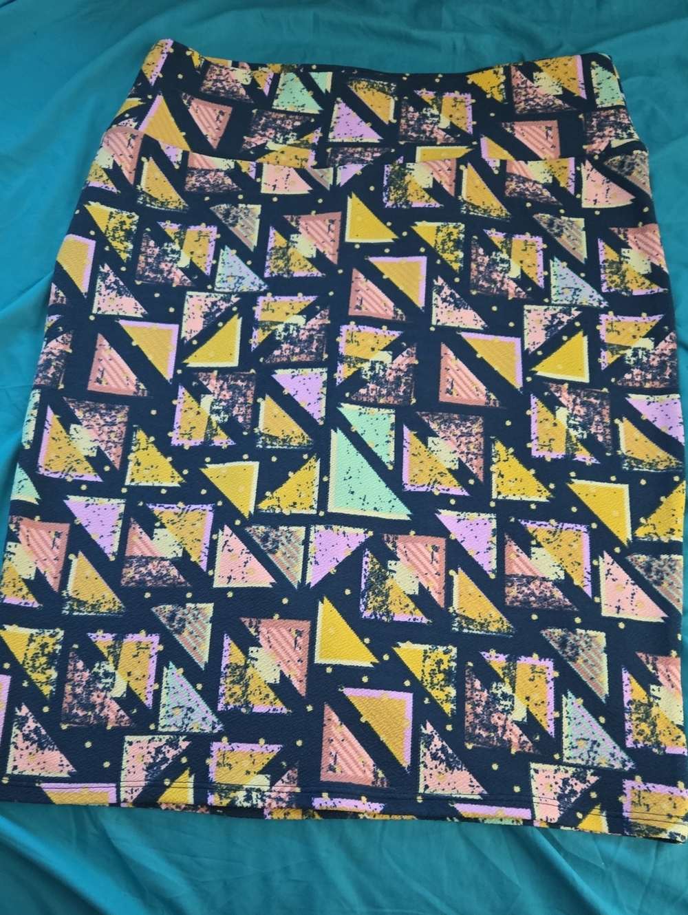 LuLaRoe Navy Pencil Skirt with Pink, Yellow and Mint Geometric Print